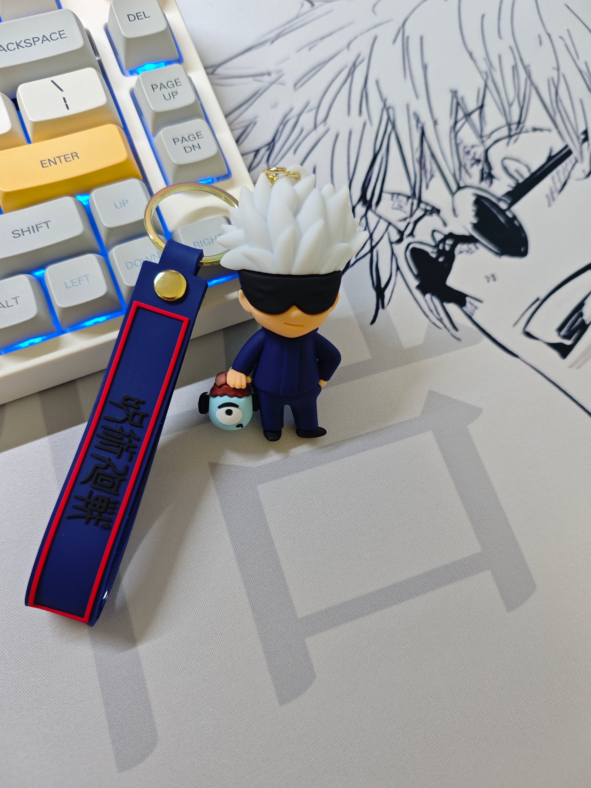 Breloc Gojo Satoru cu capul lui Gojo pus pe mousepad